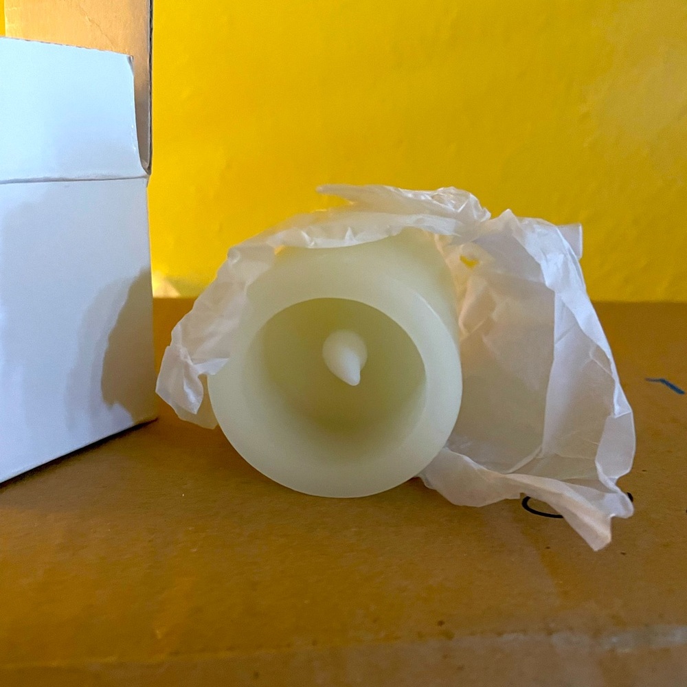 Flame less candles with red holder.